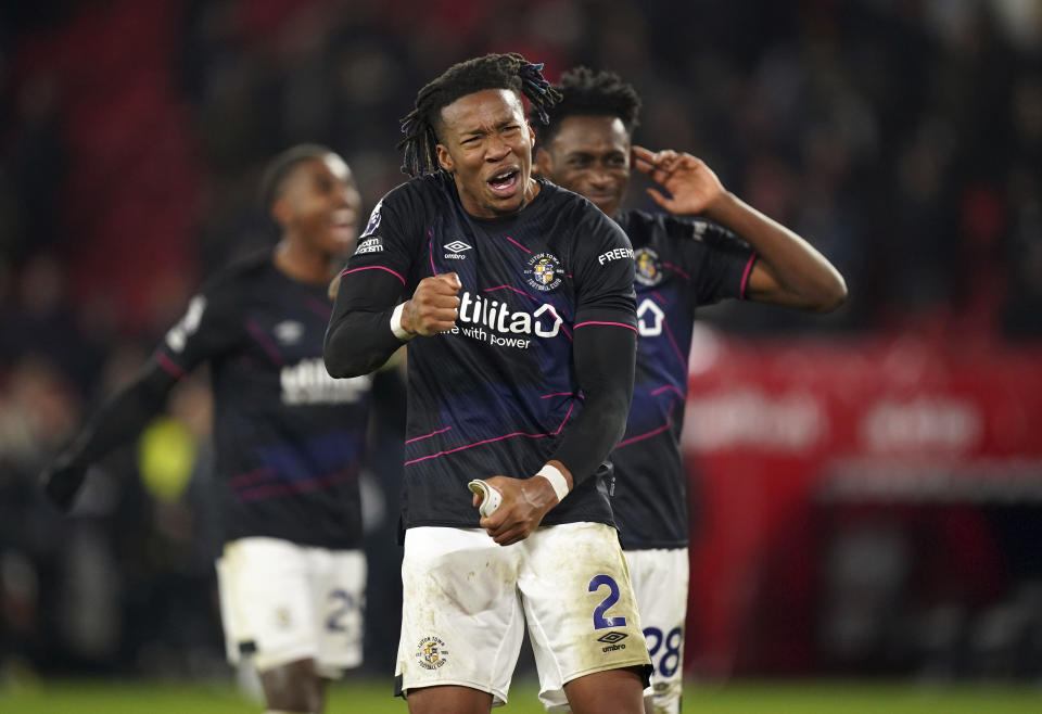 Luton Town's Gabriel Osho, front, celebrates following the English Premier League soccer match between Sheffield United and Luton Town at Bramall Lane, Sheffield, England, Tuesday, Dec. 26, 2023. (Mike Egerton/PA via AP)
