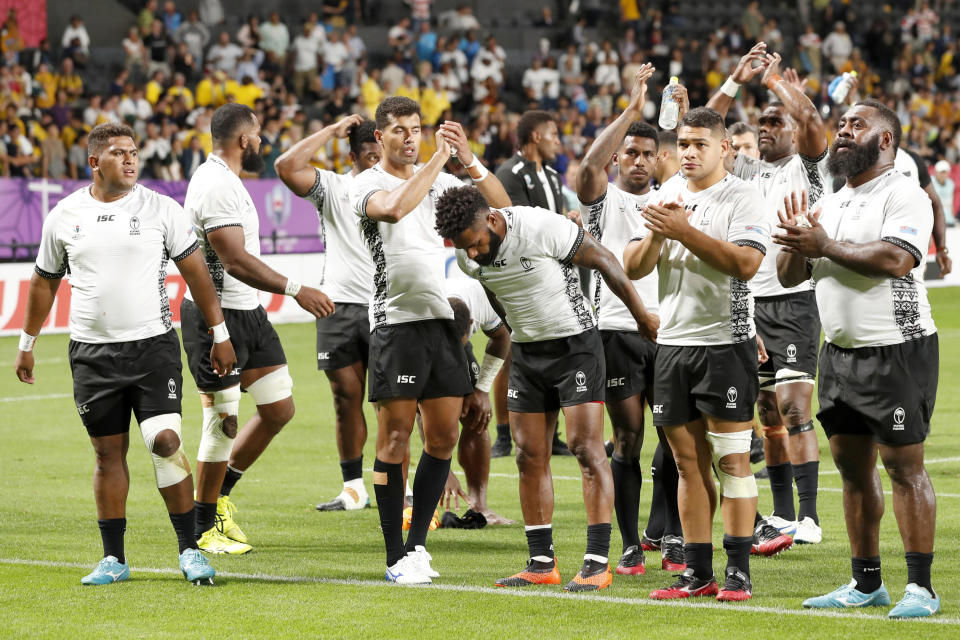 Fiji's rugby team claps to the crowd after their 39-21 loss to Australia during the Rugby World Cup Pool D game at Sapporo Dome between Australia and Fiji in Sapporo, Japan, Saturday, Sept. 21, 2019. (Juntaro Yokoyama/Kyodo News via AP)