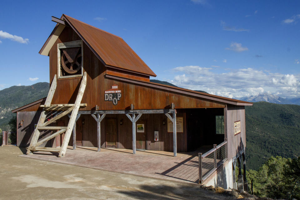 FILE - The Haunted Mine Drop is shown in this July 2017 file photo at Glenwood Caverns Adventure Park in Glenwood Springs, Colo. The parents of a 6-year-old Colorado girl who fell 110 feet to her death on the theme park ride after not being buckled in are suing the park. The lawsuit filed Wednesday, Oct. 20, 2021, alleges Glenwood Caverns Adventure Park recklessly caused her death by failing to train the ride's operators despite previous problems with its seat belts. (Chelsea Self/Glenwood Springs Post Independent via AP, File)
