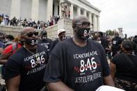 Philonise Floyd, right, brother of George Floyd, gets ready to march from the Lincoln Memorial to the Martin Luther King Jr. Memorial during the March on Washington, Friday Aug. 28, 2020, in Washington. (AP Photo/Alex Brandon)