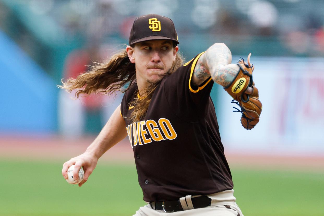 San Diego Padres starting pitcher Mike Clevinger throws against the Cleveland Guardians during the first inning in the first baseball game of a doubleheader, Wednesday, May 4, 2022, in Cleveland. (AP Photo/Ron Schwane)