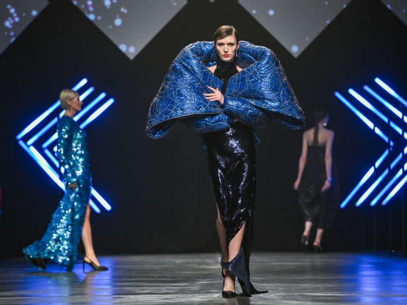 Models show creations by designer Kilian Kerner in the Verti Music Hall during the Berlin Fashion Week. Jens Kalaene/dpa