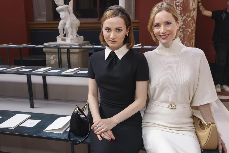 Maude Apatow, left, and Leslie Mann attend the Valentino Spring/Summer 2024 womenswear fashion collection presented Sunday, Oct. 1, 2023 in Paris. (AP Photo/Vianney Le Caer)