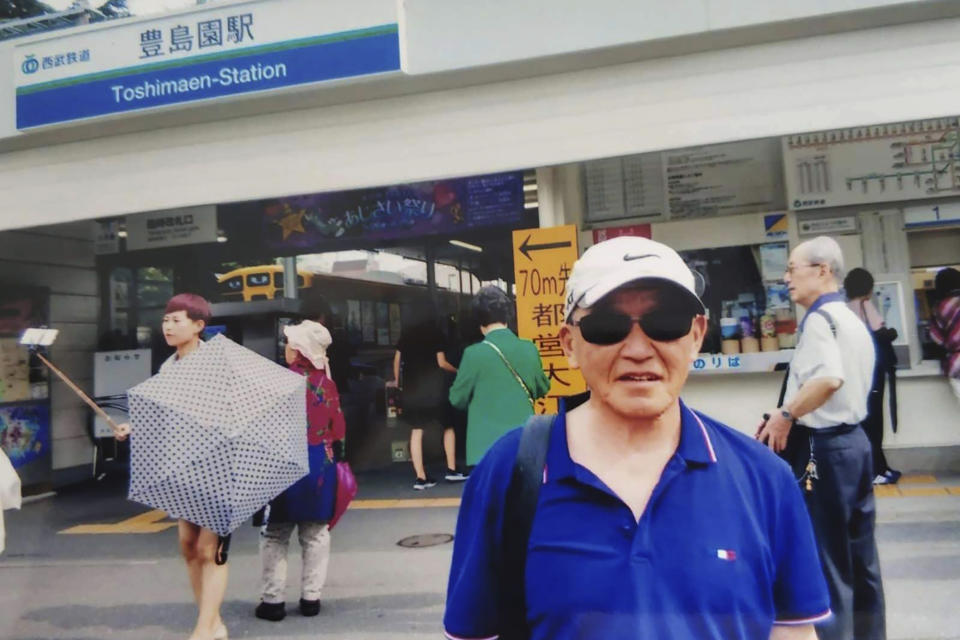 In this photo taken and released by Xi Jingbo, Xi Jingbo poses for a photo in Tokyo during one of his annual return visit to Japan in June, 2018. More than 2,500 children of about 400,000 Japanese - many of them families of Imperial Army soldiers, Manchurian railway employees and farmers who had emigrated to northern China, where Japan established a wartime puppet state - were displaced or orphaned. Xi Jingbo's parents were Japanese, but he had no official record of his place and date of birth. Villagers told him he was left behind when the Japanese fled after the surrender. (Xi Jingbo via AP)