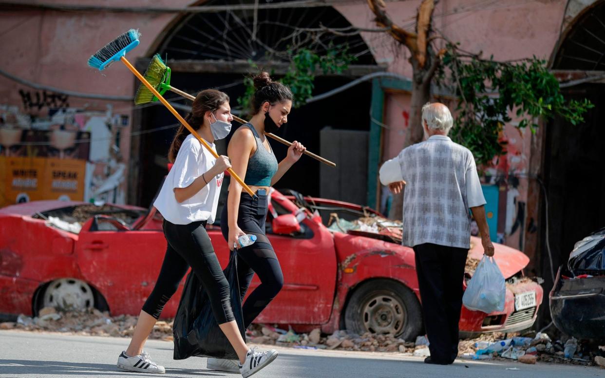 An army of volunteers cleaned up Beirut after last Tuesday's devastating port explosion - AFP