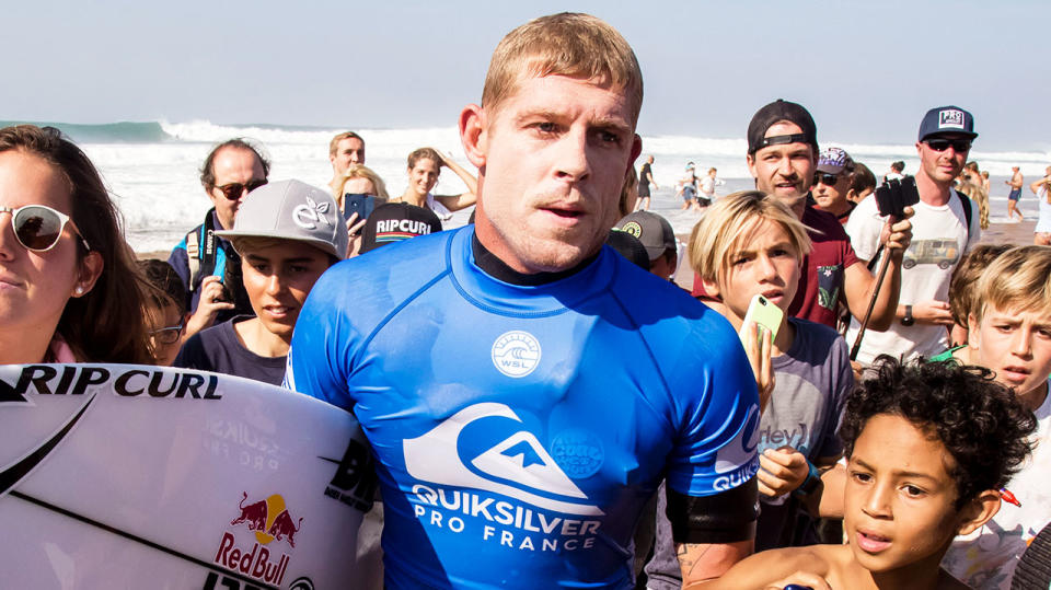 Mick Fanning (pictured middle) surrounded by fans on his farewell tour.