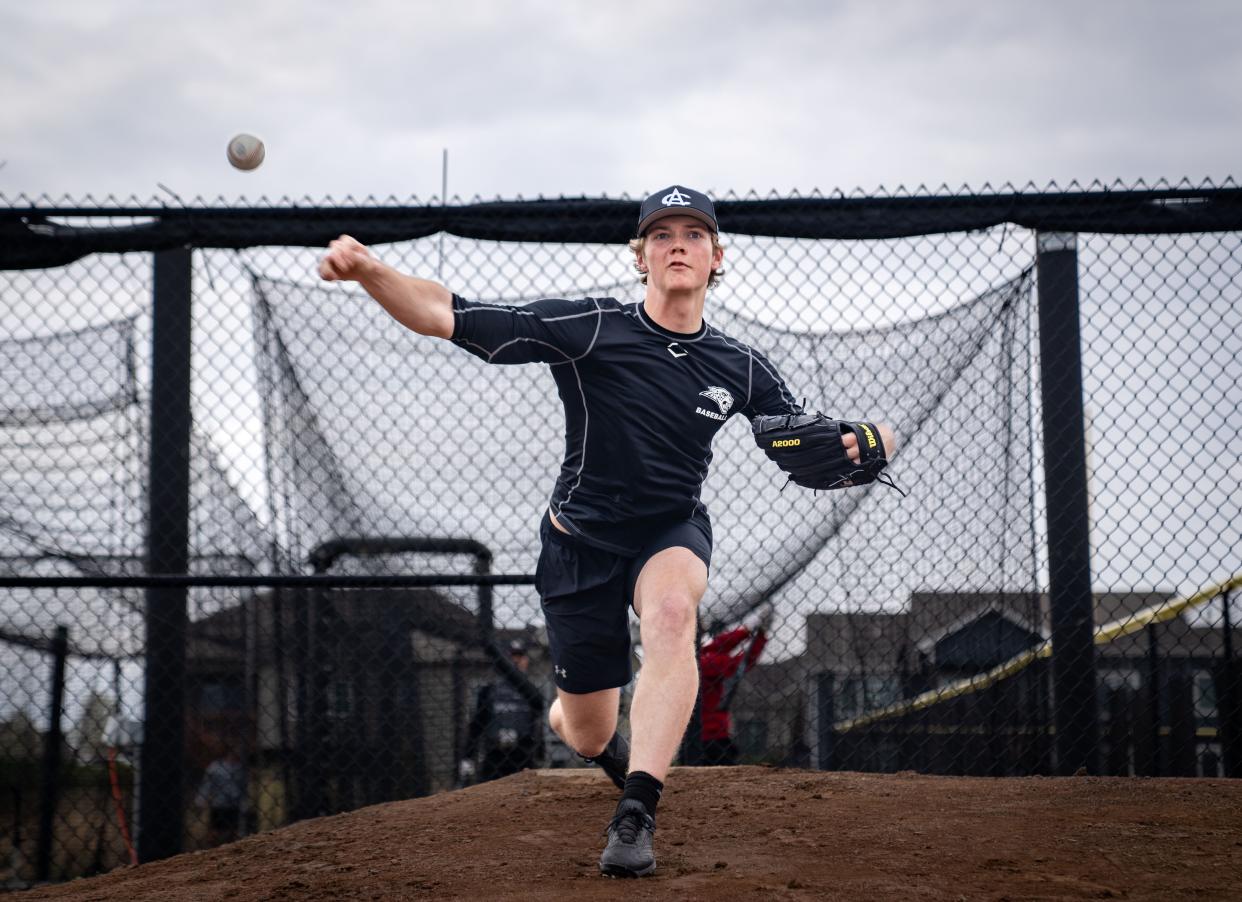 Ankeny Centennial pitcher Joey Oakie warms up at practice on April 19, 2023, in Ankeny.