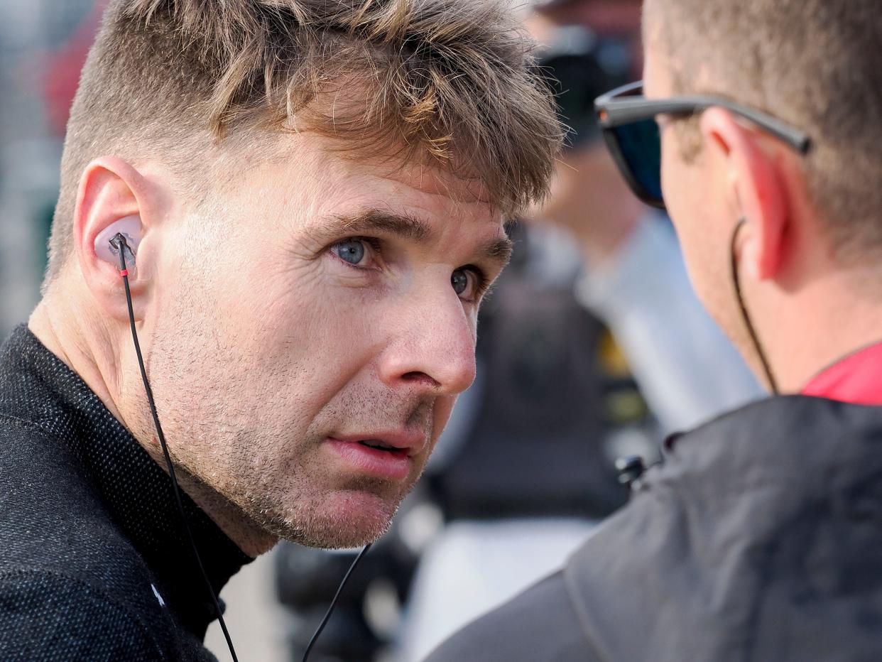 Team Penske driver Will Power (12) walks by his pit box Friday, May 10, 2024, during practice for the Sonsio Grand Prix at Indianapolis Motor Speedway.