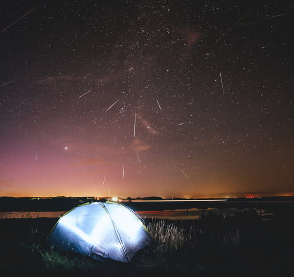 Photographer Ruslan Merzlyakov captured this spectacular photograph of the Perseid meteor shower filling the Danish sky in the early morning of Aug. 13. "I have been outside for about 3 hours, and the results are bloody fantastic!" he said. The