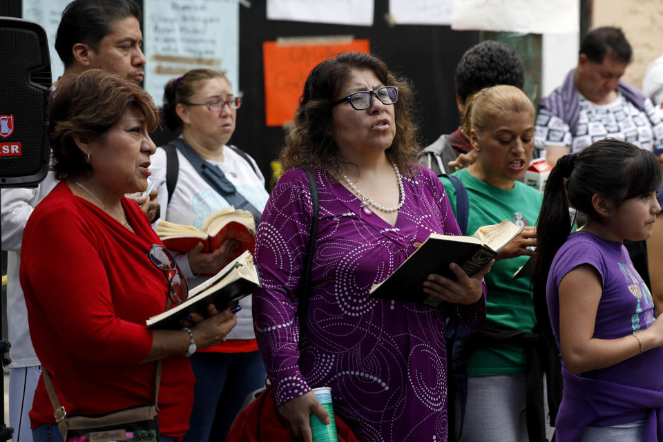 Rosalba Ramirez Vargas, center, with the prayer group 'The Best Friends of Jesus' pray while anxiously waiting for news from rescue crews at Enrique Rebsamen School in Mexico City.