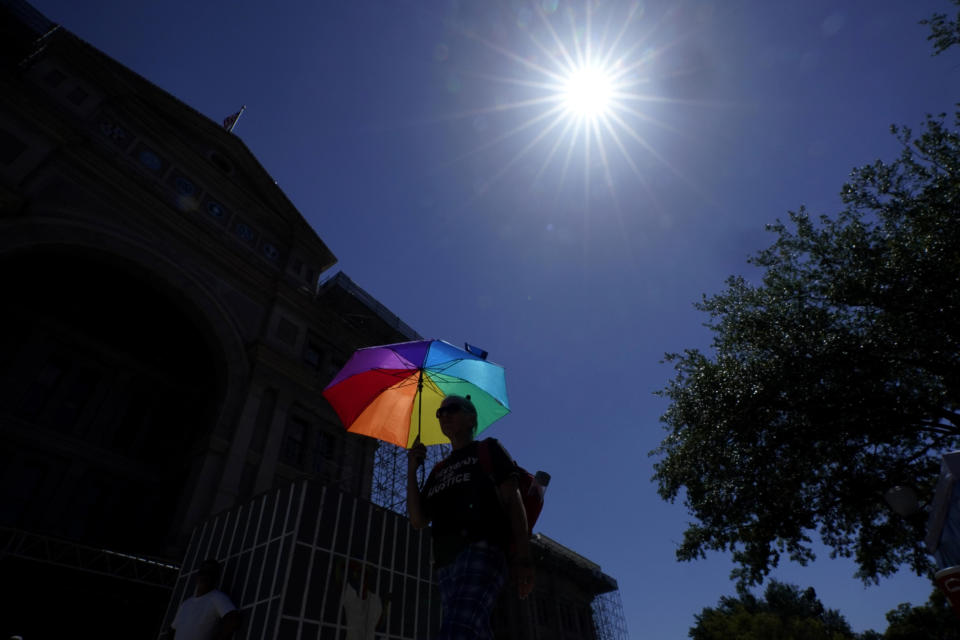 An advocate for cooling Texas prisons joins a rally on the steps of the Texas Capitol to call for an emergency special session to address the deadly heat effecting inmates, Tuesday, July 18, 2023, in Austin, Texas. (AP Photo/Eric Gay)
