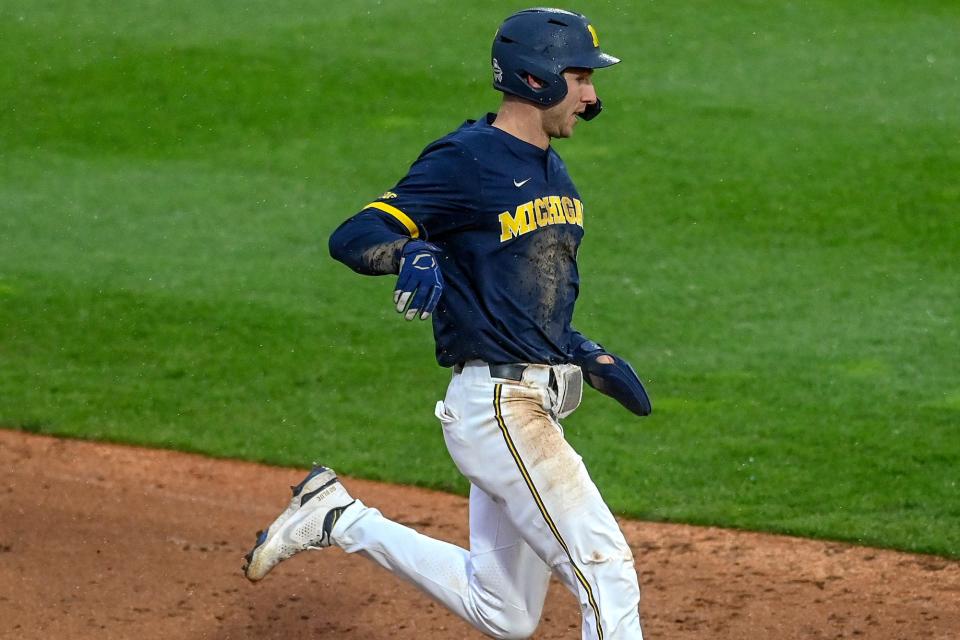 Michigan's Joe Stewart runs to third base during the sixth inning in the game against Michigan State on Friday, April 15, 2022, at Jackson Field in Lansing.