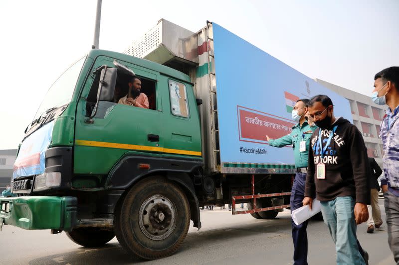 A pickup van carries Oxford-Astrazeneca COVID-19 vaccines which arrived from India as a gift to Bangladesh, in Dhaka