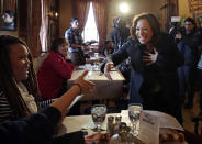 Democratic presidential candidate Sen. Kamala Harris, D-Calif., greets patrons at the Common Man Restaurant in Concord, N.H., Monday, Feb. 18, 2019. (AP Photo/Elise Amendola)