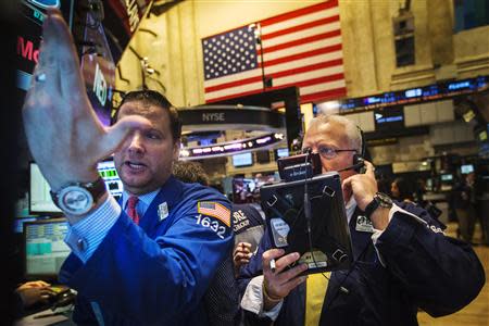 Traders work on the floor of the New York Stock Exchange shortly after the opening of markets in New York, September 4, 2013. REUTERS/Lucas Jackson