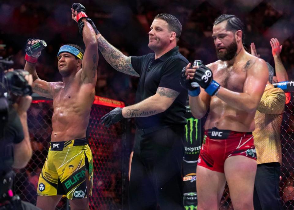 Gilbert Burns, left, defeats Jorge Masvidal in their welterweight title match during the UFC 287 event at the Kaseya Center on Saturday, April 8, 2023, in downtown Miami, Fla.