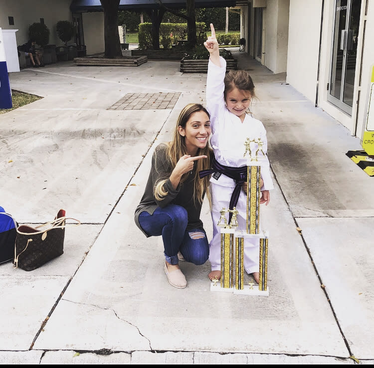 Alicia Virta posses with her karate trophy and her mom Nikki Virta. (Photo: Courtesy of Nikki Virta)