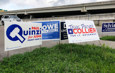 Political campaign signs stand outside a polling station in Austin, Texas, United States March 5, 2018 ahead of the first statewide U.S. primary, which will be held in Texas. REUTERS/Jon Herskovitz