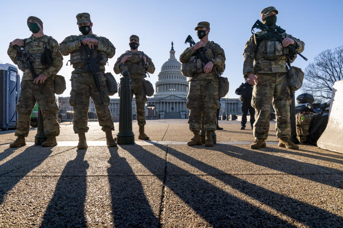 In this file photo from Wednesday, March 3, 2021, members of the Michigan National Guard join the U.S. Capitol Police to keep watch over the Capitol grounds in Washington, in the wake of the Jan. 6 insurrection by a mob loyal to former President Donald Trump. The Guard mission is ending as Democrats and Republicans spar over whether to form an independent bipartisan commission to investigate the attack that sought to overturn Trump's loss to Joe Biden. (AP Photo/J. Scott Applewhite, file)