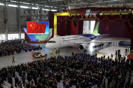 FILE PHOTO: The first C919 passenger jet made by the Commercial Aircraft Corp of China (Comac) is pulled out during a news conference at the company's factory in Shanghai, November 2, 2015. REUTERS/Stringer/File Photo