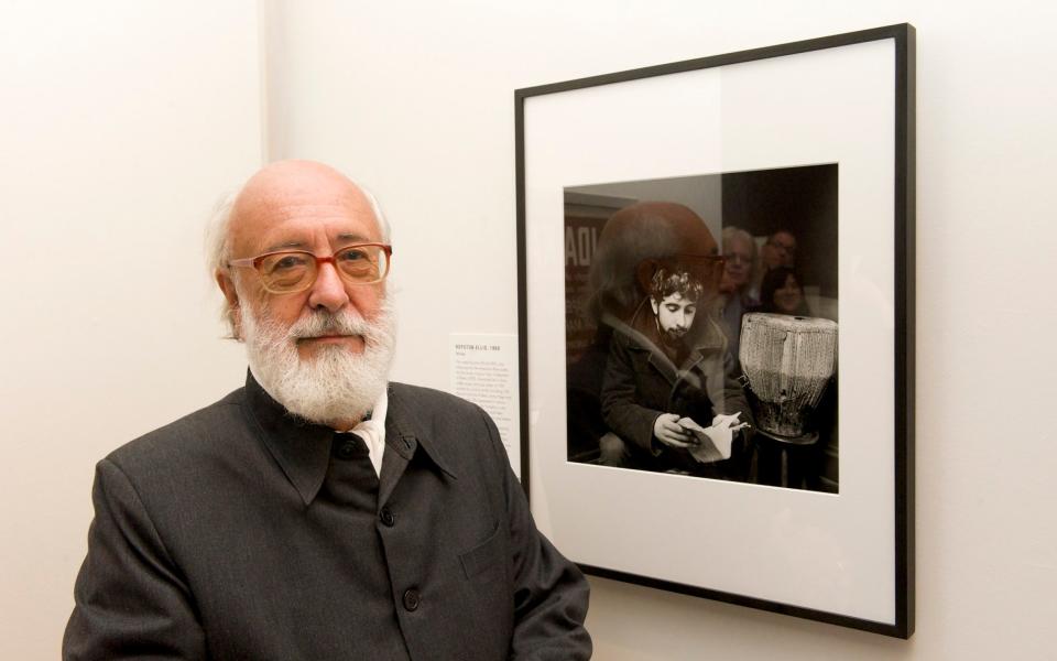 Royston Ellis poses next to his portrait by Ida Kar at the National Portrait Gallery in 2011 - Jorge Herrera/WireImage