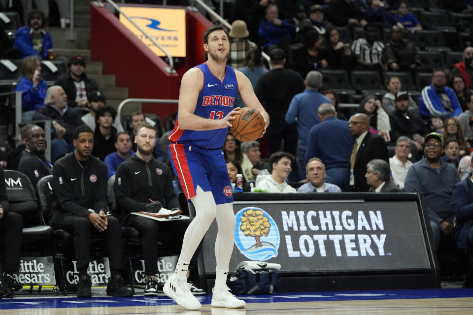 Detroit Pistons forward Danilo Gallinari attempts a three-point basket during the first half of an NBA basketball game against the Orlando Magic, Sunday, Feb. 4, 2024, in Detroit. (AP Photo/Carlos Osorio)