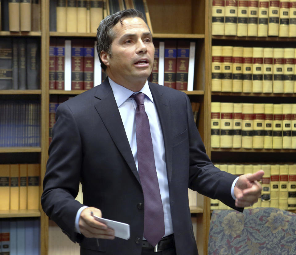 Kansas City-area businessman Greg Orman speaks to reporters after he and his running mate Sen. John Doll delivered more than 10,000 signatures to the Secretary of State's office in Topeka, Kan., Monday morning, Aug. 6, 2018, to formalize their campaign for governor. He needs the signatures of 5,000 registered voters to appear on the November ballot. (Thad Allton/The Topeka Capital-Journal via AP)