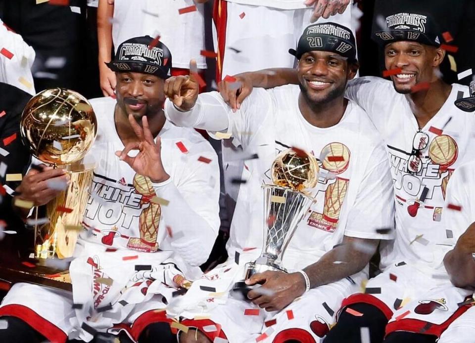 Dwyane Wade, LeBron James and Chris Bosh celebrate after defeating the San Antonio Spurs 95-88 to win Game 7 of the 2013 NBA Finals.