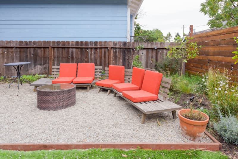 Seating around fire pit in shared home.