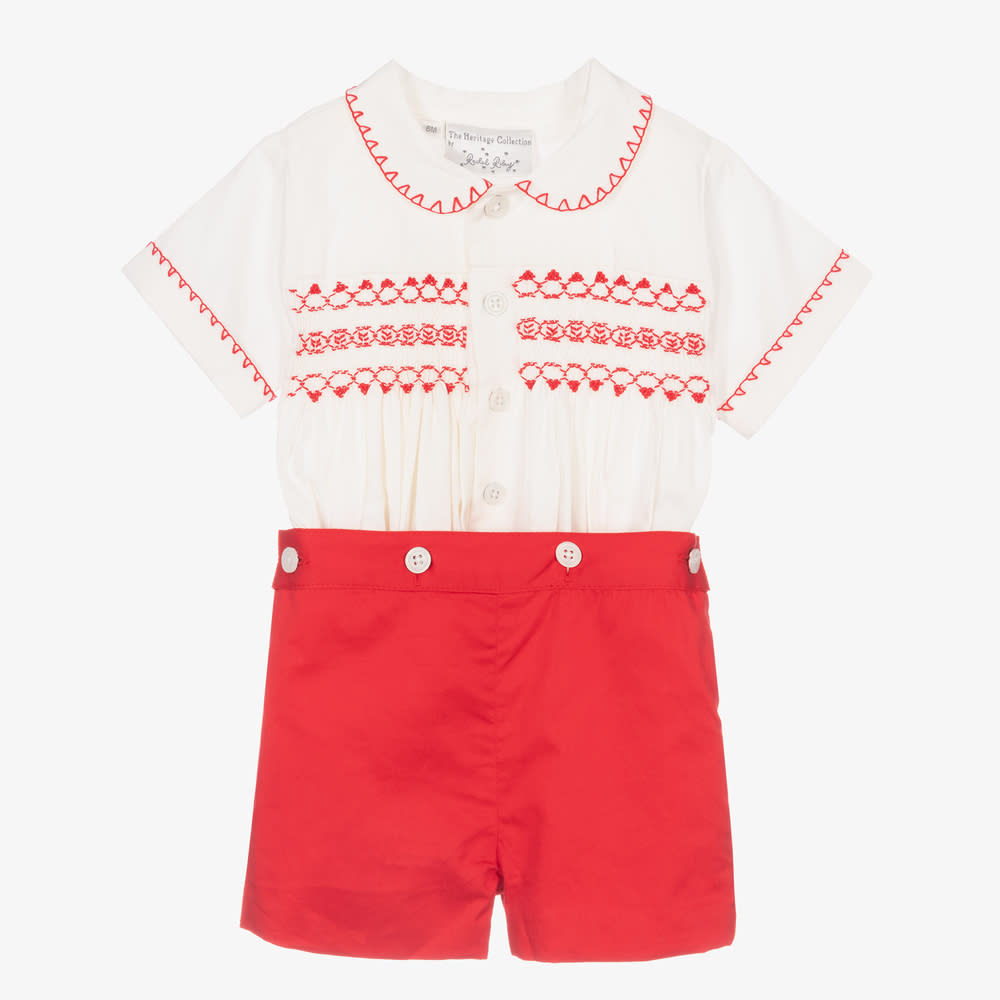<p><a href="https://go.redirectingat.com?id=74968X1596630&url=https%3A%2F%2Fwww.childrensalon.com%2Frachel-riley-red-smocked-buster-suit-187375.html&sref=https%3A%2F%2Fwww.townandcountrymag.com%2Fstyle%2Ffashion-trends%2Fg40300677%2Froyal-approved-childrenswear-brands%2F" rel="nofollow noopener" target="_blank" data-ylk="slk:Shop Now;elm:context_link;itc:0;sec:content-canvas" class="link rapid-noclick-resp">Shop Now</a></p><p>Red Smocked Buster Suit</p><p>$105.00</p><p>childrensalon.com</p><span class="copyright">Product Shot Image</span>