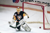 FILE - Pittsburgh Penguins goalie Tom Barrasso (35) knocks away another shot during the second period of Game 3 in the Stanley Cup finals against the Chicago Blackhawks in Chicago, Saturday, May 31, 1992. Barrasso is one of five players elected to the Hockey Hall of Fame, Wednesday, June 21, 2023. (AP Photo/John Swart, File)