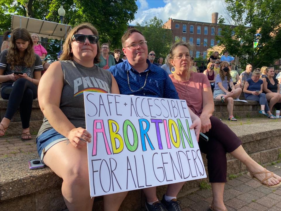Ericka Pyles, Mitchel Pyles and Holly Dennard advocate for abortion rights as the listen to speaker during the "Bans Off Our Bodies" rally at Henry Law Park in Dover on Friday, June 24, 2022.