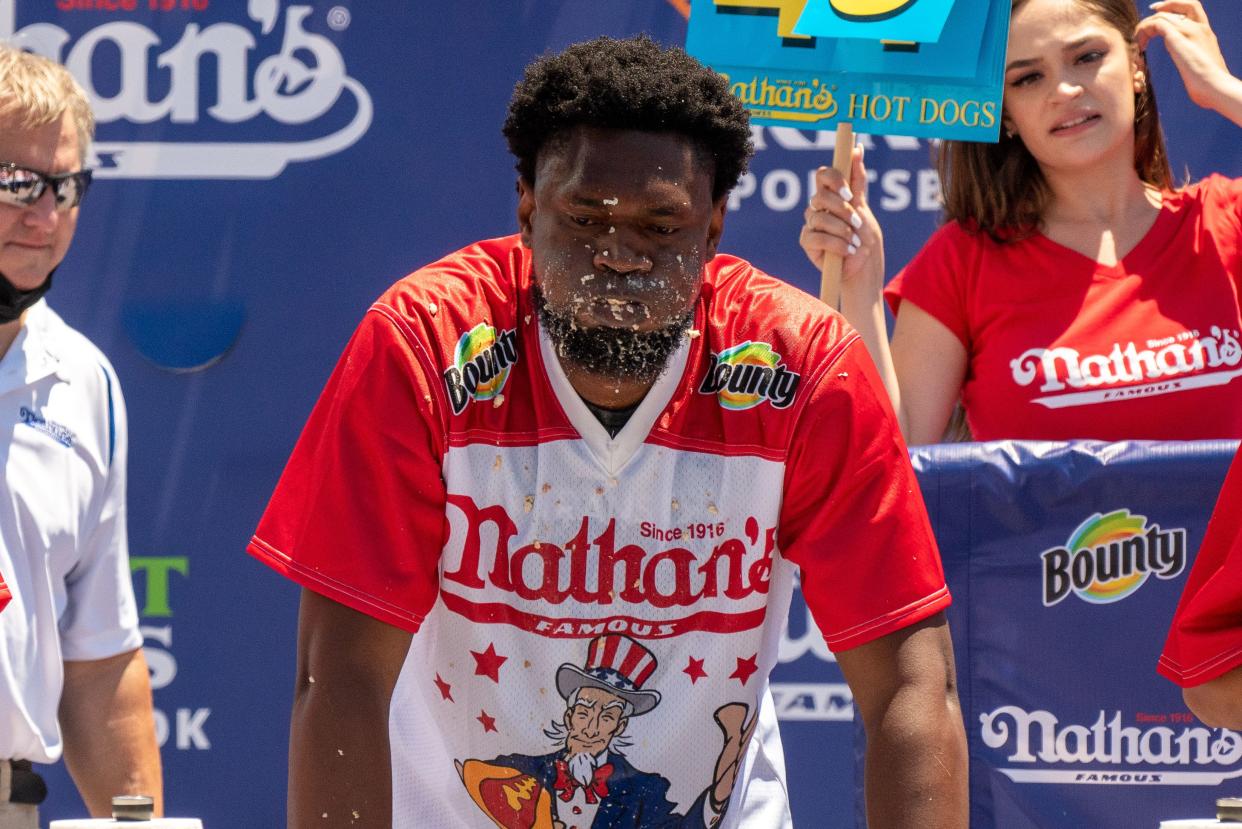 Competitive eater Gideon Oji participates in the 2021 Nathan's Famous 4th Of July International Hot Dog Eating Contest on July 4, 2021, in New York City.