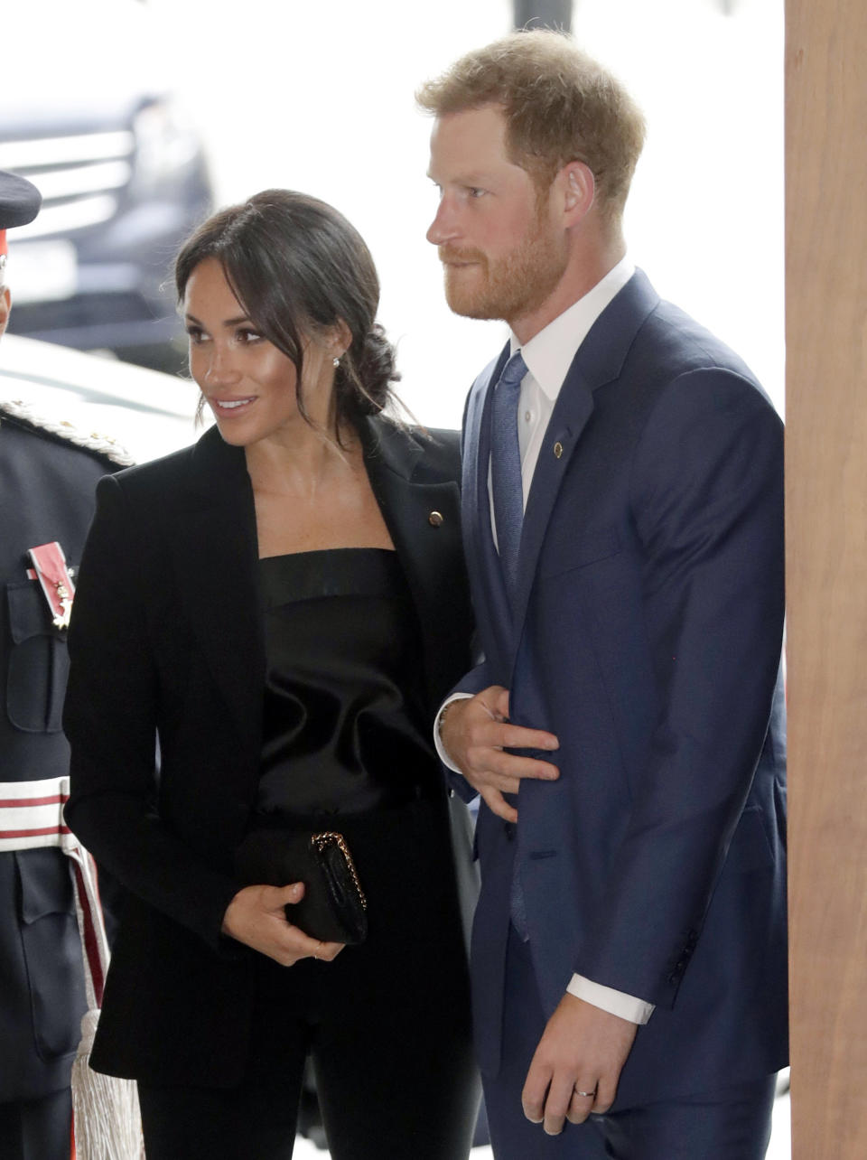 FILE - In this file photo dated Tuesday, Sept. 4, 2018, in his capacity as patron of the charity WellChild, Britain's Prince Harry and his wife Meghan, the Duchess of Sussex arrive for the annual WellChild awards in London. Kensington Palace announced Monday Oct. 15, 2018, that Prince Harry and his wife the Duchess of Sussex are expecting a child in spring 2019. (AP Photo/Matt Dunham, FILE)