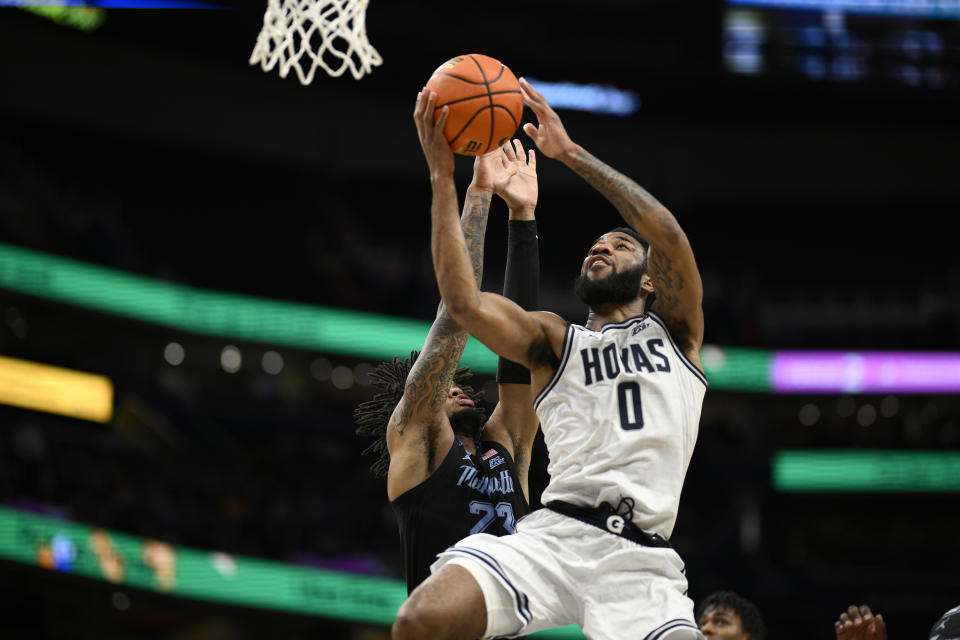 Georgetown guard Dontrez Styles (0) goes to the basket against Marquette forward David Joplin (23) during the second half of an NCAA college basketball game, Saturday, Feb. 3, 2024, in Washington. (AP Photo/Nick Wass)