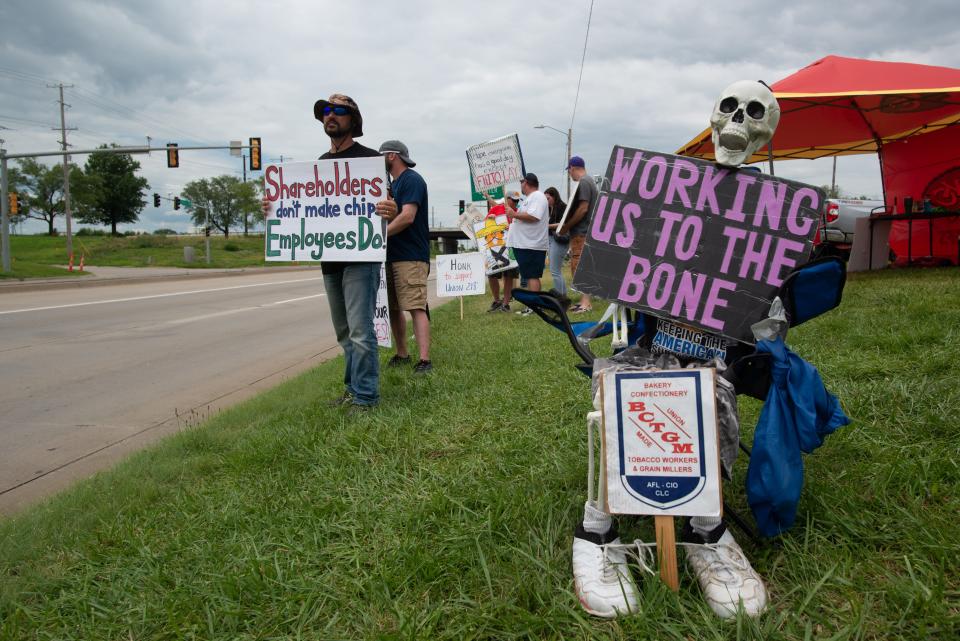 A skeleton with a sign accompanies Frito-Lay employees as they call for better pay and working conditions while striking on July 12, 2021. This photo was part of the winning entry in the Kansas Press Association's photographer of the year competition won by Evert Nelson, chief photojournalist/creative director for The Capital-Journal.