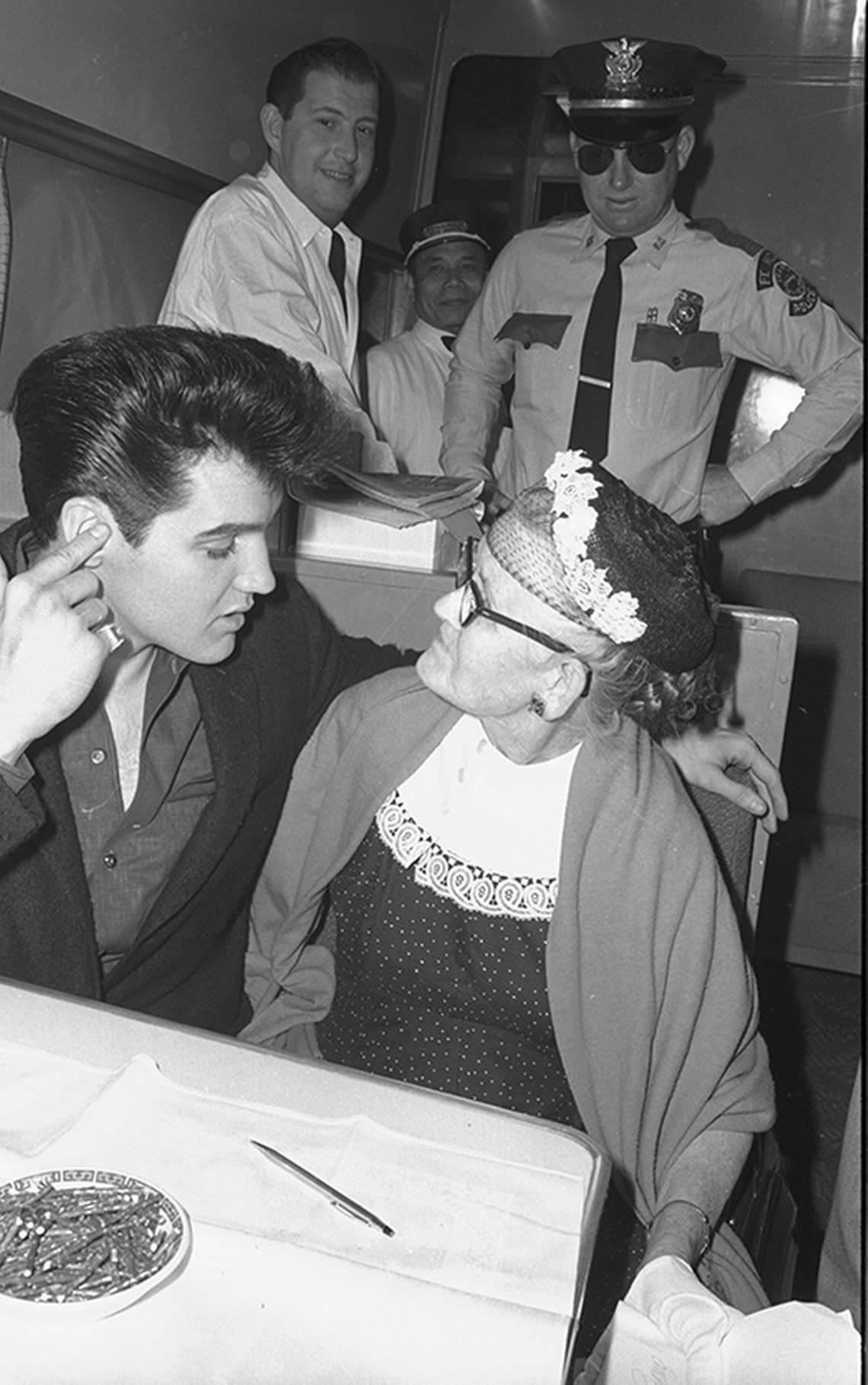 April 19, 1960: Elvis Presley, 25, with Mrs. Carrie Tywater, 69, on the Texas Eagle at T&P train station in Fort Worth during a stopover en route to Hollywood to film “G.I. Blues.”