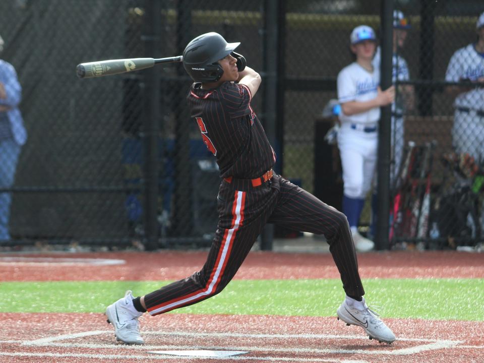 Taunton's Dwayne Burgo hits a single during a Hockomock League game against Attleboro on May 16, 2023.