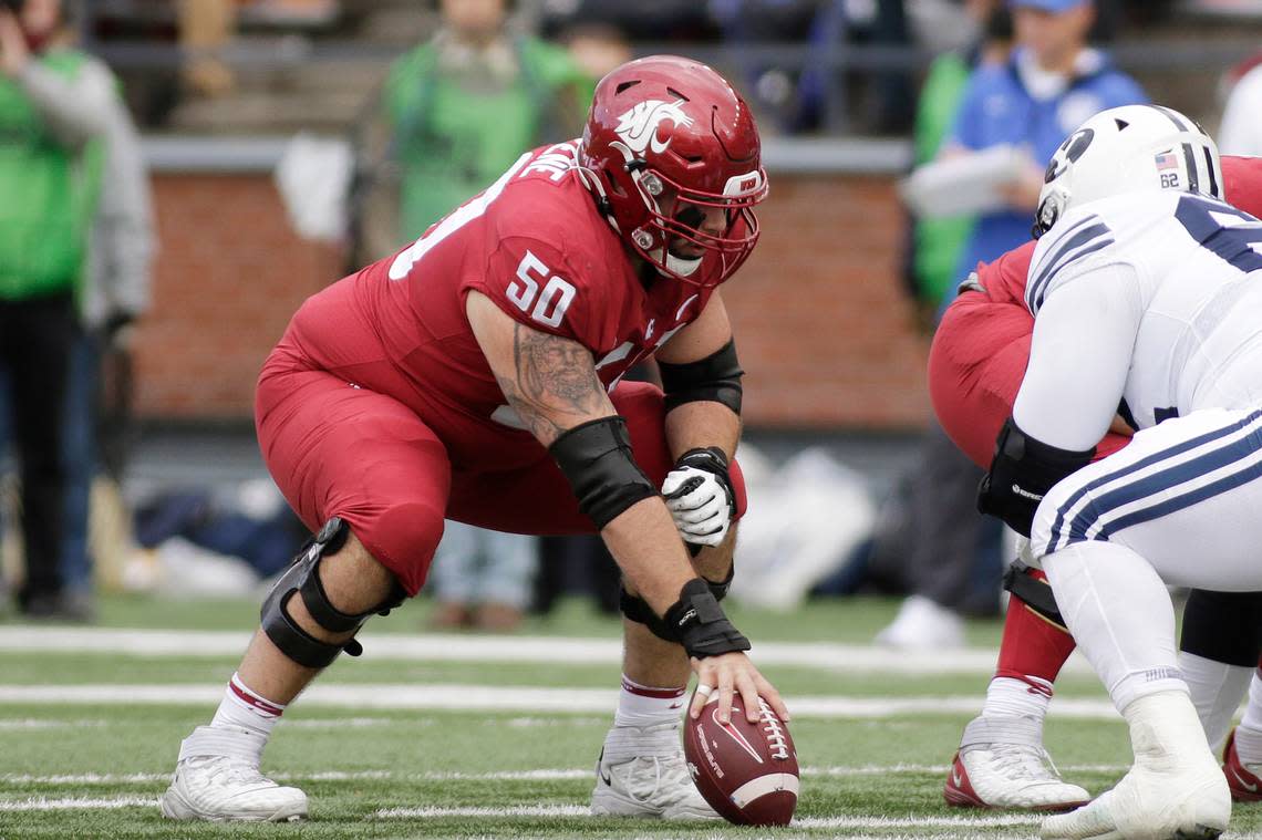 Washington State offensive lineman Brian Greene (50) prepares to snap the ball during the first half of an NCAA college football game against BYU, Saturday, Oct. 23, 2021, in Pullman, Wash. (AP Photo/Young Kwak)