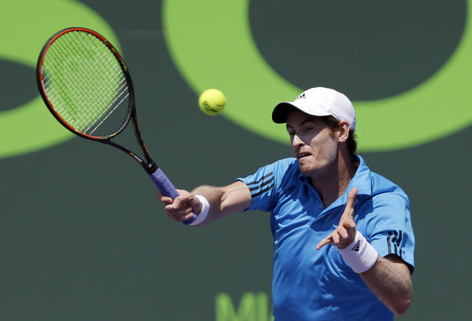 Andy Murray, of Great Britain, returns to Feliciano Lopez, of Spain, at the Sony Open tennis tournament in Key Biscayne, Fla., Sunday, March 23, 2014. (AP Photo/Alan Diaz)