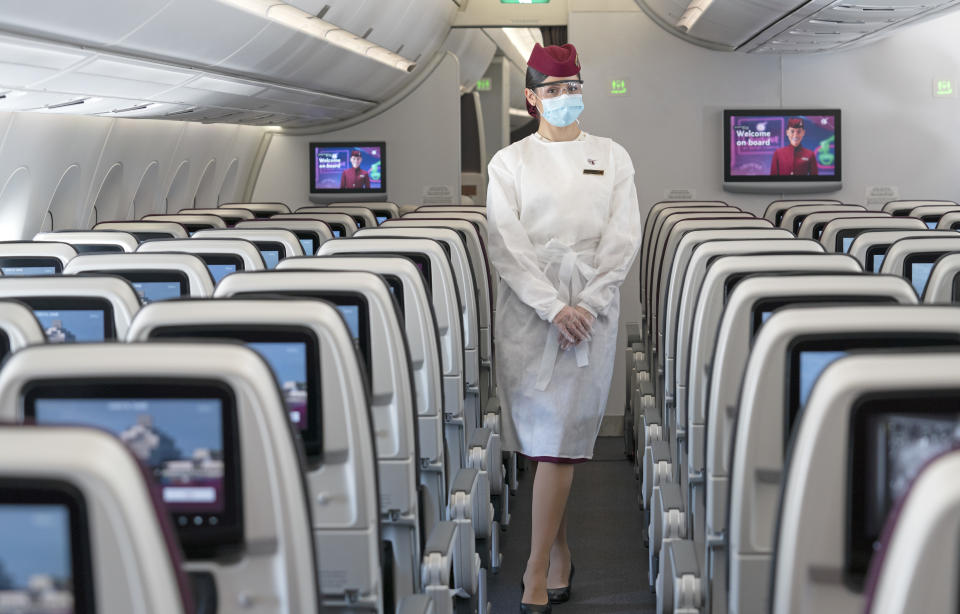 Qatar cabin crew will wear protective gowns as well as glasses, masks and gloves. Photo: Qatar Airways (supplied.)