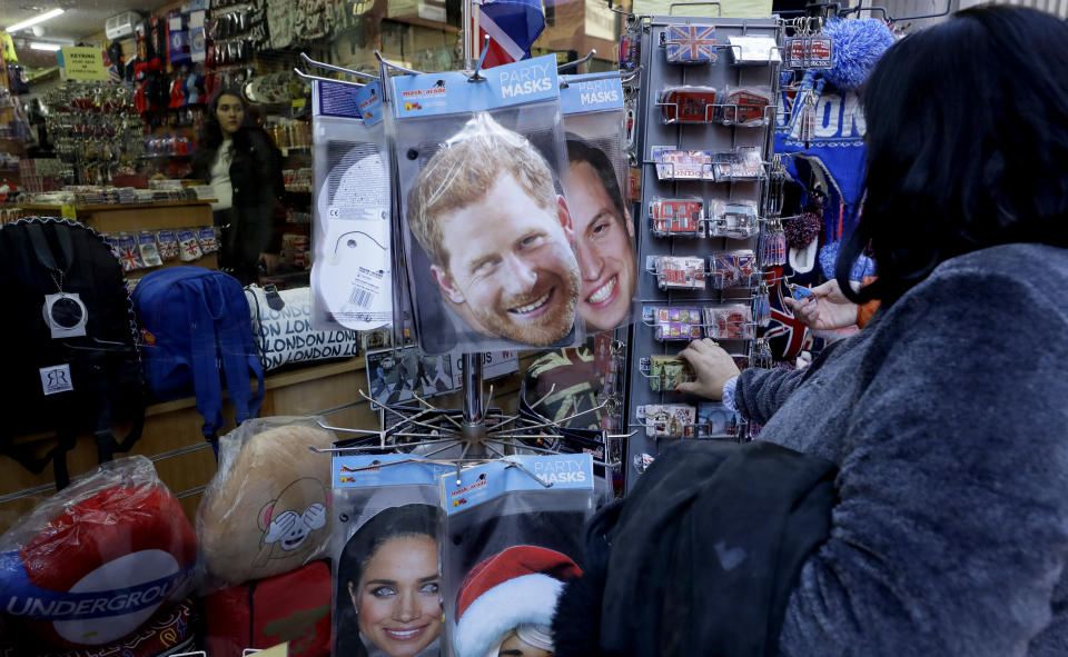 Royal souvenirs for sale in London, Thursday, Jan. 9, 2020. In a statement Prince Harry and his wife, Meghan, said they are planning "to step back" as senior members of the royal family and "work to become financially independent."(AP Photo/Kirsty Wigglesworth)