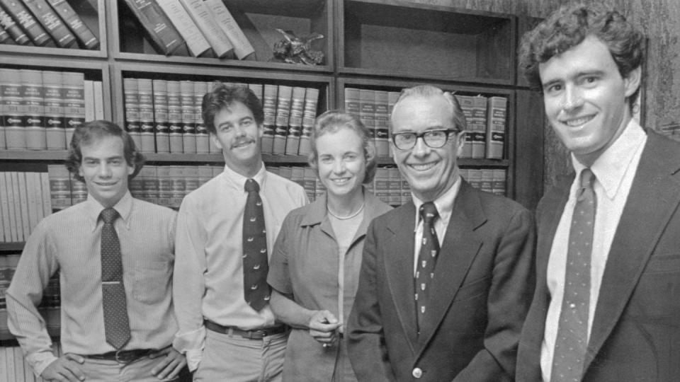 jay o'connor, brian o'connor, sandra day o'connor, john jay o'connor iii, and scott o'connor smile for a photo together while standing in front of a bookshelf