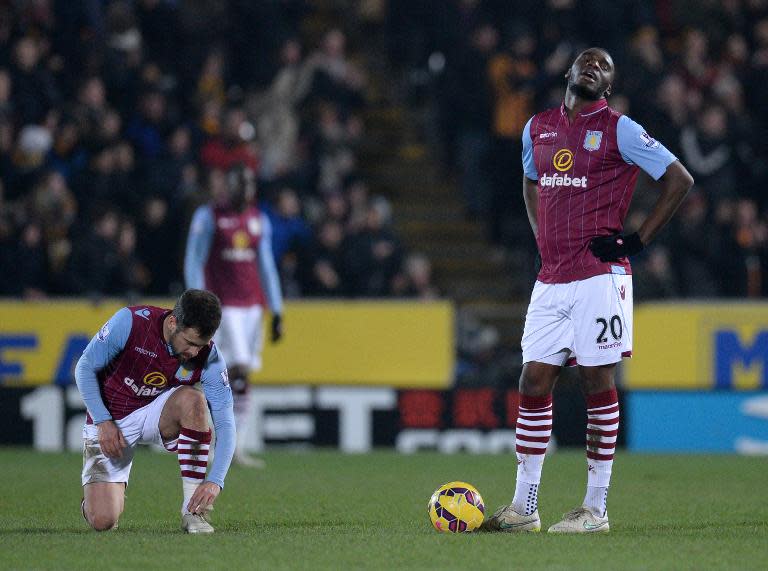 Aston Villa's Joe Cole (L) and Christian Benteke react during their English Premier League match against Hull City, at the KC Stadium in Hull, north-east England, on February 10, 2015