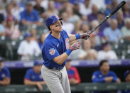 Chicago Cubs' Frank Schwindel flies out against Colorado Rockies starting pitcher Jon Gray in the second inning of a baseball game Wednesday, Aug. 4, 2021, in Denver. (AP Photo/David Zalubowski)