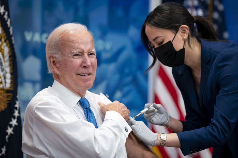 President Joe Biden receives a booster dose of the COVID-19 vaccine at the Eisenhower Executive Office Building in Washington in 2022. File Photo by Al Drago/UPI
