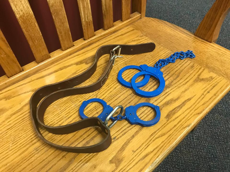 These shackles consisting of handcuffs, a leather waist belt and leg irons are used by the Staunton City Sheriff's Office and weigh just under 2 1/2 pounds.
