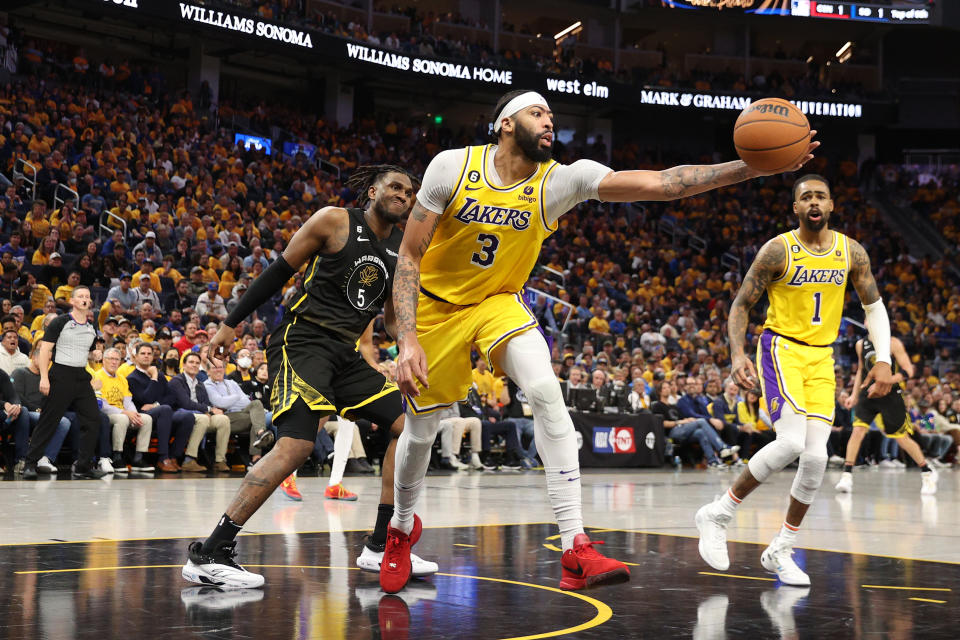 Anthony Davis and the Los Angeles Lakers held on to beat the Golden State Warriors in Game 1 of their Western Conference semifinals series on Tuesday night.