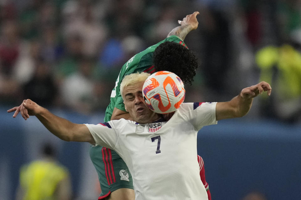 Giovanni Reyna of the United States (7) and Jorge Sanchez of Mexico battle for a header during the first half of a CONCACAF Nations League semifinal soccer match Thursday, June 15, 2023, in Las Vegas. (AP Photo/John Locher)