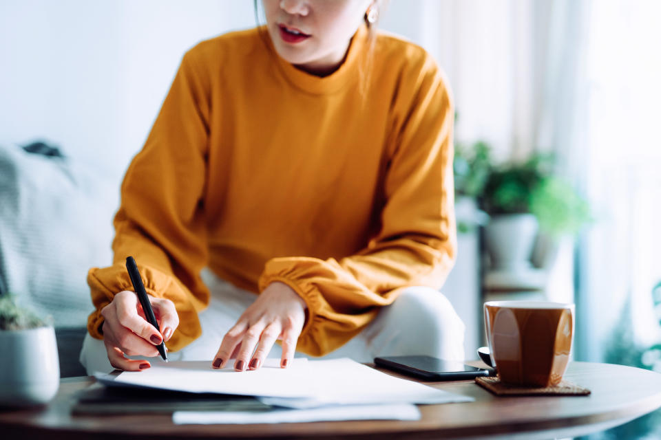 Woman signing a document